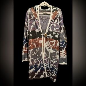 Long boho hooded sweater with large button toggle closure.